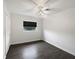 Simple bedroom with wood flooring, ceiling fan, and a bright window view at 224 Briar Cliff Dr, Longwood, FL 32779