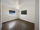 Bedroom featuring hardwood floors, ceiling fan, and two windows at 224 Briar Cliff Dr, Longwood, FL 32779