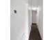 Hallway with hardwood floors and closet, thermostat, and recessed lighting at 224 Briar Cliff Dr, Longwood, FL 32779
