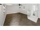 Bright living room with tile floors, ceiling fan, and access to other rooms at 224 Briar Cliff Dr, Longwood, FL 32779