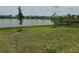 Spacious backyard with a scenic lake view, ideal for relaxation and outdoor enjoyment at 2620 Blowing Breeze Ave, Kissimmee, FL 34744