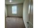 Bedroom featuring neutral paint, carpet, and a window for natural light at 2620 Blowing Breeze Ave, Kissimmee, FL 34744