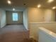 Upstairs bonus room is carpeted and features neutral paint and plenty of space at 2620 Blowing Breeze Ave, Kissimmee, FL 34744