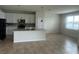 Well-lit kitchen with an island, stainless steel appliances, and ample cabinet space at 2620 Blowing Breeze Ave, Kissimmee, FL 34744