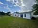 Backyard with a grassy lawn and a house at 2673 Dixie Ln, Kissimmee, FL 34744