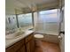 Bathroom with a sink, toilet, and shower at 2673 Dixie Ln, Kissimmee, FL 34744