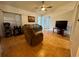 Comfortable living room with tile flooring, a ceiling fan, and a relaxing atmosphere at 2673 Dixie Ln, Kissimmee, FL 34744