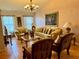 Elegant living room with formal seating, decorative accents, and large windows that enhance its appeal at 2673 Dixie Ln, Kissimmee, FL 34744