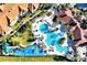 Aerial view of community pools, playgrounds, landscaping, and building architecture at 2781 Almaton Loop # 105, Kissimmee, FL 34747