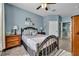 The sunny bedroom features a metal frame bed and tiled floors at 2781 Almaton Loop # 105, Kissimmee, FL 34747