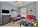 Bright bedroom showcasing two twin beds, tile flooring, and a ceiling fan at 2781 Almaton Loop # 105, Kissimmee, FL 34747
