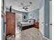 This bedroom features a ceiling fan and light blue walls at 2781 Almaton Loop # 105, Kissimmee, FL 34747