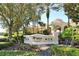 The Windsor Hills Clubhouse sign is surrounded by landscaping at 2781 Almaton Loop # 105, Kissimmee, FL 34747