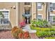 Condo exterior showcasing verdant landscaping, walkway, and entrance with address at 2781 Almaton Loop # 105, Kissimmee, FL 34747