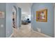 Hallway view showcasing the blue walls leading to the dining and living areas at 2781 Almaton Loop # 105, Kissimmee, FL 34747