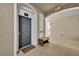 Condo hallway featuring neutral tones, an exit sign, and a bench at 2781 Almaton Loop # 105, Kissimmee, FL 34747