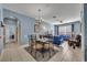 Open-concept living and dining area featuring modern furnishings and neutral flooring at 2781 Almaton Loop # 105, Kissimmee, FL 34747