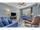 Cozy living room featuring comfortable seating, neutral flooring, and natural light at 2781 Almaton Loop # 105, Kissimmee, FL 34747