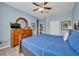 Well-lit main bedroom featuring tile floors, a ceiling fan, and light-blue walls at 2781 Almaton Loop # 105, Kissimmee, FL 34747