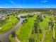 Breathtaking aerial view of the golf course community with lush greenery and serene lakes at 2885 Autumn Green Dr, Orlando, FL 32822