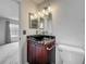 Bathroom with unique vessel sink, granite countertop, decorative mirrors, and updated fixtures at 2885 Autumn Green Dr, Orlando, FL 32822