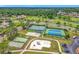 Aerial view showcasing tennis courts, playground, bocce ball, and other neighborhood amenities at 2885 Autumn Green Dr, Orlando, FL 32822