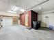 Spacious garage with storage shelves, access door, and functional layout for parking and organization at 2885 Autumn Green Dr, Orlando, FL 32822