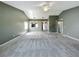 Spacious living room with carpet, neutral paint, and lots of natural light at 2885 Autumn Green Dr, Orlando, FL 32822