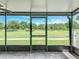 Enjoy picturesque golf course views from this screened porch, perfect for relaxing or entertaining at 2885 Autumn Green Dr, Orlando, FL 32822