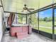 Relax in this screened porch with a hot tub, ceiling fan and views of the golf course at 2885 Autumn Green Dr, Orlando, FL 32822