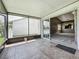 View of the house and living room from the screened in porch with tile flooring at 2885 Autumn Green Dr, Orlando, FL 32822