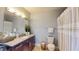 Full bathroom featuring granite counters, modern fixtures, and a shower/tub combination at 300 E South St # 6003, Orlando, FL 32801
