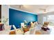 Stylish dining area with seating for four, blue accent wall and balcony access at 300 E South St # 6003, Orlando, FL 32801