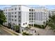 Elegant condo building with manicured landscaping, and gray and white exterior at 300 E South St # 6003, Orlando, FL 32801
