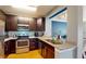 Modern kitchen features stainless steel appliances, granite counters, and wood cabinets at 300 E South St # 6003, Orlando, FL 32801