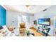 Bright living room with hardwood floors, balcony access, and neutral furnishings at 300 E South St # 6003, Orlando, FL 32801