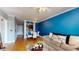Inviting living space with hardwood floors, blue accent wall, and comfortable seating at 300 E South St # 6003, Orlando, FL 32801