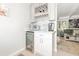 Chic bar area with a wine fridge, wine rack, and seamless access to the living area for easy entertaining at 3104 Harrison Ave # E-30, Orlando, FL 32804