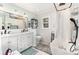 Bright, remodeled bathroom with double vanity, a soaking tub, and elegant fixtures, offering a spa-like experience at 3104 Harrison Ave # E-30, Orlando, FL 32804