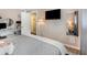 Comfortable bedroom with a wall mounted TV, modern furnishings, and soft lighting, perfect for relaxation and entertainment at 3104 Harrison Ave # E-30, Orlando, FL 32804
