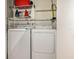 Bright laundry room features a modern, white washer and dryer set for convenient chore days at 3104 Harrison Ave # E-30, Orlando, FL 32804