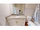 Bathroom with a white single sink vanity, granite countertop, and a shower-tub combo at 3238 Wish Ave, Kissimmee, FL 34747