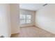 Bedroom with carpet floors, a window and white walls at 3238 Wish Ave, Kissimmee, FL 34747