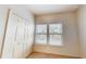 Bedroom with carpet floors, a window and a closet at 3238 Wish Ave, Kissimmee, FL 34747