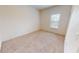 Bedroom with carpet floors, a window and white walls at 3238 Wish Ave, Kissimmee, FL 34747