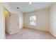 Bedroom with carpet floors, a window and white walls at 3238 Wish Ave, Kissimmee, FL 34747