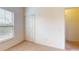 Well-lit bedroom includes closet, carpeted floor and a window, offering a comfortable retreat at 3238 Wish Ave, Kissimmee, FL 34747
