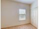 Bedroom with carpet floors, a window and white walls at 3238 Wish Ave, Kissimmee, FL 34747