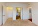 Spacious carpeted bedroom with multiple closets, and bathroom at 3238 Wish Ave, Kissimmee, FL 34747