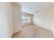 Bright bedroom featuring neutral carpet, a large window, and ample natural light at 3238 Wish Ave, Kissimmee, FL 34747